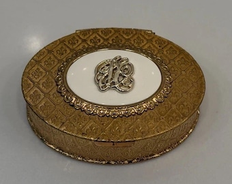 Vintage Jacqueline Cochran goudkleurige compact wit geëmailleerd fleur de lis met spiegel
