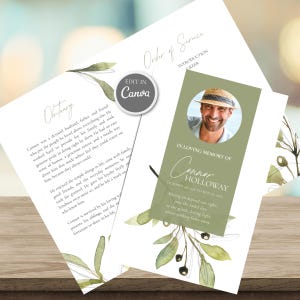 May include: A funeral programme template featuring a white background with watercolour olive branch illustrations. The front panel includes a circular photo of a man in a straw hat, the text In Loving Memory of Connor Holloway, and dates.