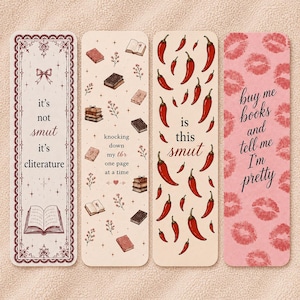May include: Four decorative bookmarks with various designs and text. One bookmark has the text "it's not smut it's cliterature". Another says "knocking down my tbr one page at a time". A third says "is this smut". The last one says "buy me books and tell me I'm pretty".