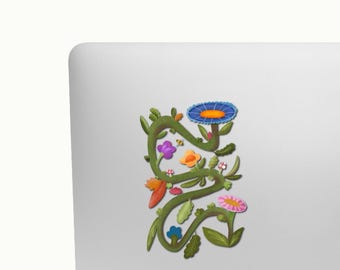 Pegatina botánica ilustrada a mano con motivos de vegetación exuberante.
