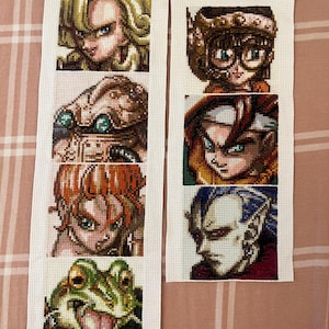 Padrões de ponto cruz com retratos dos sprites de Chrono Trigger para marcadores de livros/patches (sem IA)