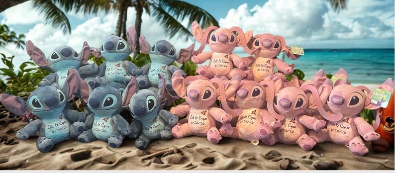 May include: A display of blue and pink Stitch plush toys, each with large ears and eyes, arranged on a sandy beach. The toys have tags and are set against a tropical backdrop of palm trees and the sea.