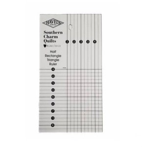 May include: A clear plastic ruler with a grid pattern and numbered markings. The ruler is labeled "Southern Charm Quilts" and "Half Rectangle Triangle Ruler".