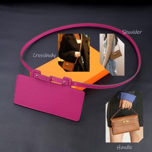 May include: A bright magenta rectangular leather phone case featuring a thin matching strap with silver-tone hardware. The case includes a top flap closure with a metal clasp. Insets show the case used as a crossbody, shoulder, and handle bag.