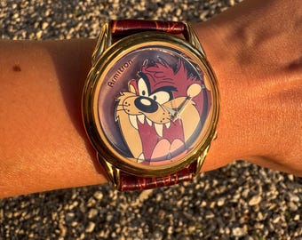 Reloj vintage Armitron de los años 90 de Taz (el demonio de Tasmania) de Looney Tunes - Cuarzo tono dorado con correa de cuero