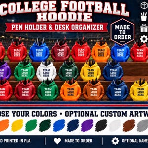 May include: A collection of 3D printed PLA pen holders shaped like miniature hoodies in various colors, each featuring the text TEAM LOGO HERE. The display includes a color palette chart and text stating COLLEGE FOOTBALL HOODIE PEN HOLDER & DESK ORGANIZER.