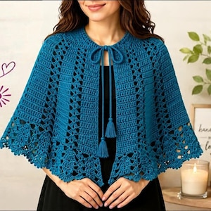 May include: A teal crochet capelet featuring an intricate openwork pattern, a round neckline, and a front tie closure finished with two matching tassels. The garment is crafted with a repeating stitch design that flares toward the scalloped hem.