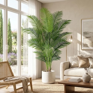 May include: A tall, vibrant green palm plant with long, feathery fronds extending outwards. The plant is potted in a cylindrical, speckled white planter with a smooth finish, positioned upright on a floor surface in a bright, sunlit room.