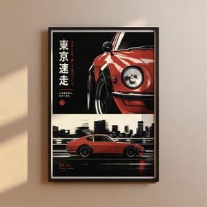 May include: A framed poster featuring a red sports car. The top section shows a close-up of the front headlight and fender with Japanese text. The bottom section displays the full car in motion against a blurred city skyline with Tokyo, Japan text.