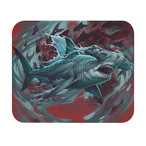 May include: A rectangular mouse pad featuring a detailed illustration of a hammerhead shark swimming through turbulent water. The shark is rendered in shades of teal and blue, with its mouth open, set against a deep red and dark background.