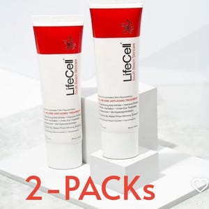 May include: Two white tubes of LifeCell anti-aging treatment with red caps and text. The tubes are on a white surface, with the words "2-PACKS" in red at the bottom. The product is from South Beach Skincare.