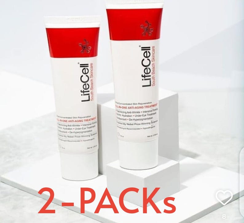 May include: Two white tubes of LifeCell anti-aging treatment with red caps and text. The tubes are on a white surface, with the words "2-PACKS" in red at the bottom. The product is from South Beach Skincare.