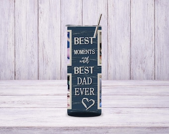 May include: A navy blue tumbler with a stainless steel straw. The tumbler features the text "BEST MOMENTS with BEST DAD EVER" in white, along with a white heart. The design includes photo frames.