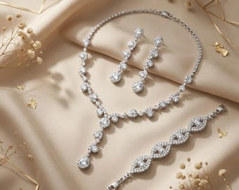 Conjunto de joyas nupciales con pedrería que incluye collar, pendientes y pulsera para bodas y graduaciones.