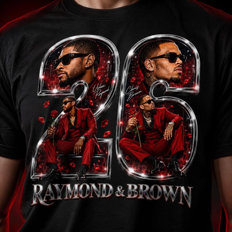 May include: A black t-shirt featuring a large graphic of the number 26 in metallic silver. Inside the numbers are portraits and full-body images of Usher Raymond and Chris Brown in red suits holding roses. The text reads Usher Raymond, Chris Brown, and RAYMOND & BROWN.