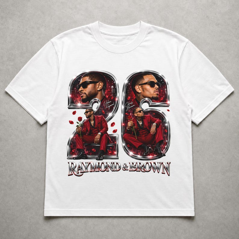 May include: A white t-shirt featuring a graphic print of the number 26 in a metallic chrome finish. Inside the numbers are portraits of two men in red suits holding red roses. The text "RAYMOND & BROWN" appears in metallic chrome lettering below.