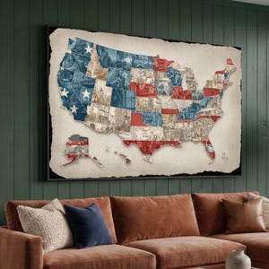 May include: A framed map of the United States, with a collage of historical images within each state's borders. The map is in the shape of the U.S. with a distressed, vintage aesthetic. The colour palette includes red, white, and blue, with a neutral background.