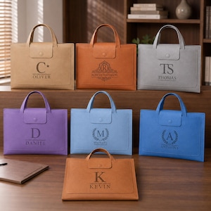 May include: Seven rectangular document bags in tan, orange, gray, purple, light blue, blue, and brown, each featuring two top handles, a snap-button flap closure, and personalized engravings including names like Oliver, Robert Harrison, Thomas, Daniel, Michael, Anthony, and Kevin.