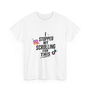 May include: A white short-sleeved t-shirt featuring the black text I STOPPED MY SCROLLING FOR THIS. The design includes a colorful Instagram logo icon to the left of the word STOPPED and a colorful TikTok logo icon to the right of the word THIS.