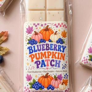 May include: A rectangular wax melt bar in clear plastic packaging with a label reading Blueberry Pumpkin Patch, Fresh Blueberries, Ripe Pumpkin, Autumn Blend, and Net Wt. 2 oz (57 g). The off-white wax features small embedded star-shaped glitter.