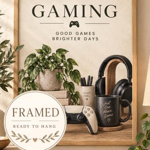 May include: A framed wall art print featuring the text GAMING, GOOD GAMES BRIGHTER DAYS, a game controller icon, a potted plant, a pencil holder labelled GAME FUEL, a black gaming headset, and a black mug with the text Just One More Game.