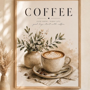 Könnte beinhalten: Ein gerahmter Kunstdruck mit einer Aquarellillustration einer Kaffeetasse mit Latte Art, einer kleinen Vase mit grünem Blattwerk und Kaffeebohnen. Der Text lautet COFFEE, SLOW BREWS, WARM CUPS und good days start with coffee.