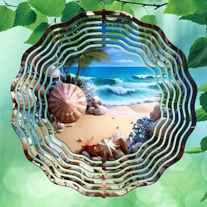 May include: A circular metal wind spinner featuring a concentric wave-like cutout design. The center displays a vibrant beach scene with blue ocean waves, sandy shores, palm trees, and various seashells including a large conch and starfish.