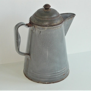 May include: A vintage gray enamel coffee pot with a lid and a handle. The pot has a speckled finish and is slightly worn.