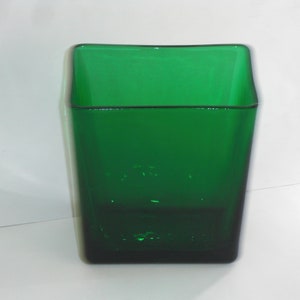 May include: A square, emerald green glass vase.