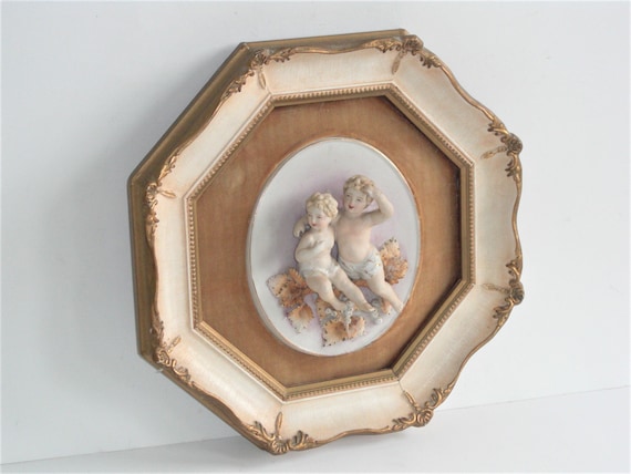 Vintage Porcelain Child Cherubs in Beige Gold Wood Composite Frame Fleur-de-lis