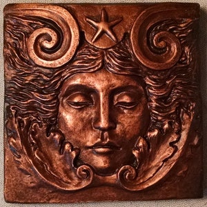 Sea goddess tile in Aged Copper finish,  4x4 inch, woman's face with swirls and starfish, Sculpted by Richard Chalifour