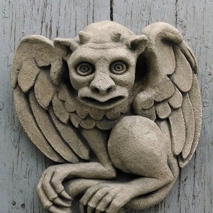 The Hypnotist gargoyle, wall art sculpture, Chicago Gothic, Halloween horror, carved stone casting, architectural detail, Richard Chalifour