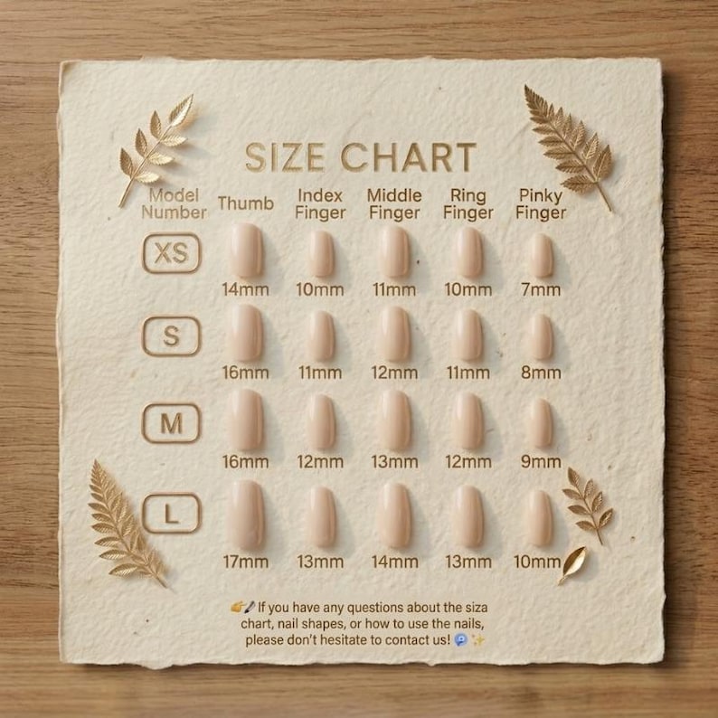 May include: A beige size chart for press-on nails featuring four rows labeled XS, S, M, and L. Each row displays five nail shapes with corresponding measurements in millimeters for the thumb, index, middle, ring, and pinky fingers, decorated with gold leaf illustrations.