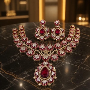 Heavy bridal set Pakistani Indian ad antique gold  with white and ruby pink color stones