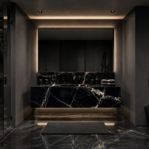 May include: A modern bathroom featuring black marble walls and flooring with white veining. The space includes a floating vanity with a matching marble countertop, a large rectangular mirror with integrated lighting, a glass shower, and a black toilet.