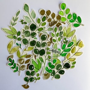 May include: A collection of watercolor painted green leaves, perfect for scrapbooking, card making, or other craft projects.