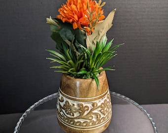 Carved Wooden Vase with Orange Floral Arrangement