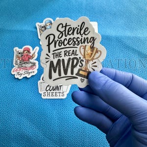 May include: A die-cut sticker featuring the black text Sterile Processing THE REAL MVP'S with a gold trophy illustration. Additional stickers include a cartoon medical professional labeled Certified Tray Slayer and a graphic labeled COUNT SHEETS.