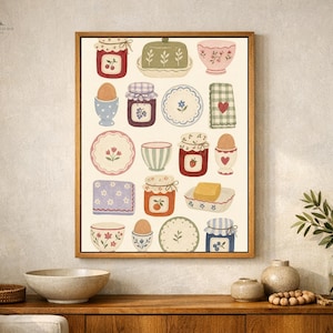 May include: A framed wall art print featuring a grid of kitchen-themed illustrations including jars of jam, eggs in cups, patterned plates, bowls, butter dishes, and folded napkins in a soft color palette of red, blue, green, and cream.