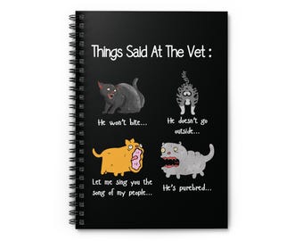 May include: A black spiral notebook with a white background and the text "Things Said At The Vet:"  Four cartoon animals are shown with humorous captions. The animals are a black cat, a gray cat, an orange dog, and a gray dog.