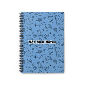 May include: A blue spiral notebook with a pattern of cats, dogs, bones, balls, and yarn. The text "Vet Med Notes" is printed in black on the front cover.