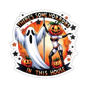 May include: A sticker with a spooky Halloween theme. It features a ghost, a woman with a pumpkin head, and the text "There's some horrors in this house".