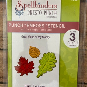 Puede incluir: Un paquete de plantillas Spellbinders Presto Punch para hojas de otoño. El paquete incluye tres plantillas de perforación en forma de hojas en rojo, dorado y verde. El texto dice "Punch, Emboss, Stencil" y "Fall Leaves".