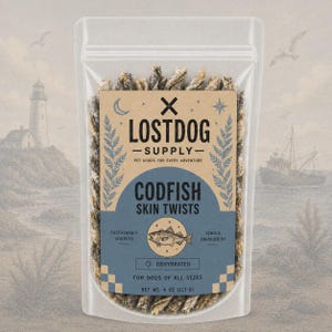 May include: A clear plastic bag filled with codfish skin twists. The bag features a label with the text "LOST DOG SUPPLY" and "CODFISH SKIN TWISTS". The label also includes the text "SUSTAINABLY SOURCED", "SINGLE INGREDIENT", and "DEHYDRATED". The net weight is 4 oz (113.6 g).