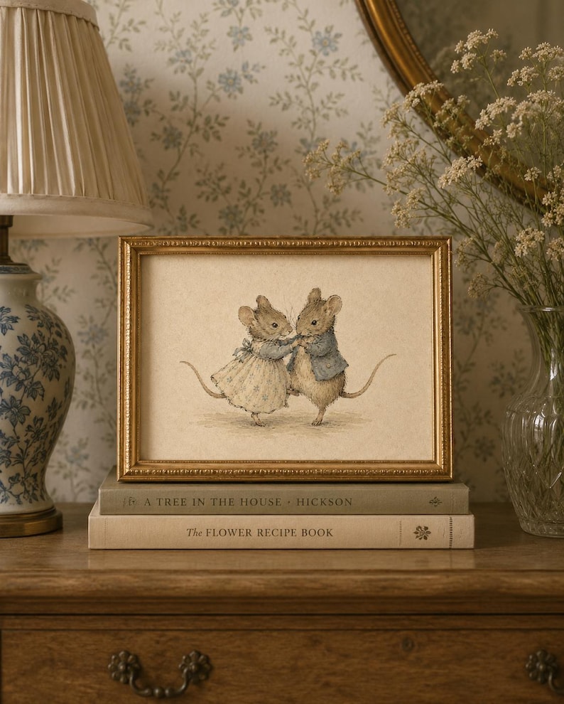 Vintage-inspired illustration of two dancing mice wearing storybook clothing, holding hands on a warm neutral background, creating whimsical printable wall art for nurseries, playrooms, and cottage-style homes.