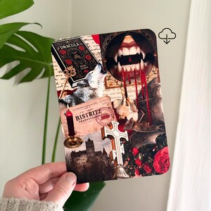 May include: A rectangular art print featuring a collage of Dracula-themed imagery, including a howling wolf, a book cover titled Dracula by Bram Stoker, a pair of fangs with dripping blood, a garlic bulb, a bat, a cross, and a castle silhouette.