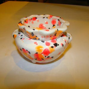 Ejemplo: Maceta pequeña de violetas (Campos de amapolas)