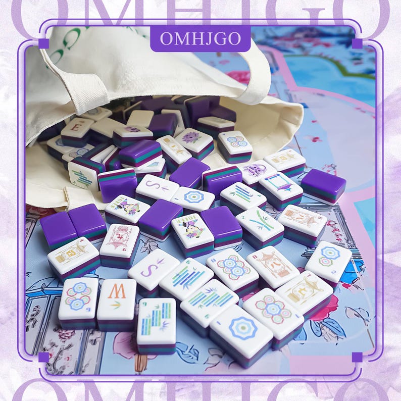 May include: A set of Mahjong tiles in a beige bag, scattered on a floral patterned surface. The tiles are white, purple, and green, with various symbols and characters. The bag has the text "OMHJGO".