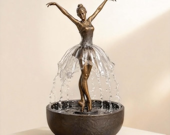 Luxus-Tischplatten-Brunnen mit anmutiger Tänzerin in mittlerer Pose mit sanftem Flow Yoga oder Wohnzimmer-Display