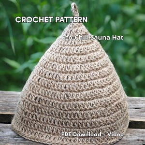 May include: A conical sauna hat made of light brown, textured crochet yarn. The text CROCHET PATTERN, Eco-Chill Sauna Hat, and PDF Download + Video are printed on the image. The hat features a small loop at the top point and a wide base.